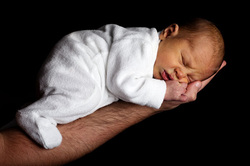 Baby on male arm